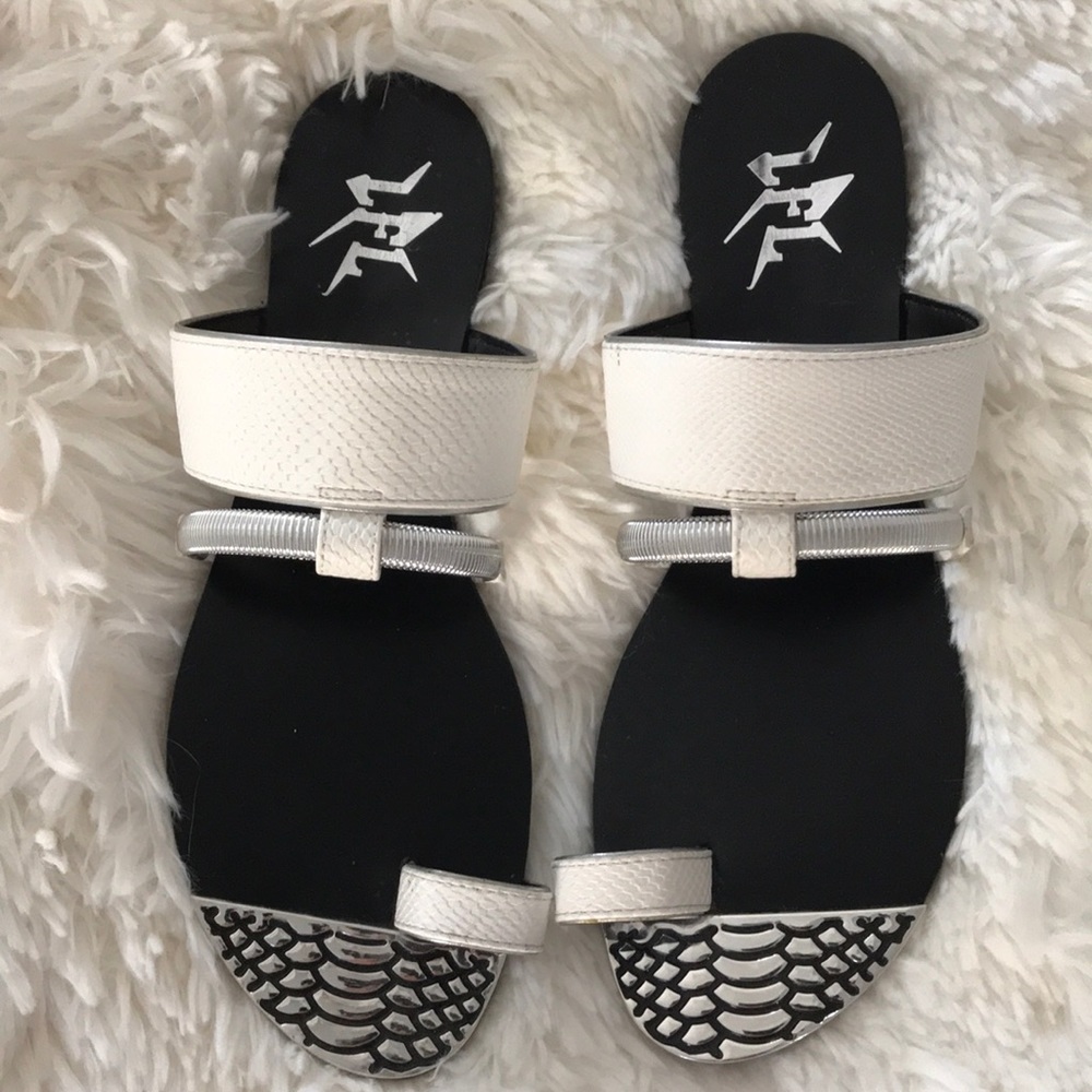 Silver and faux leather slides